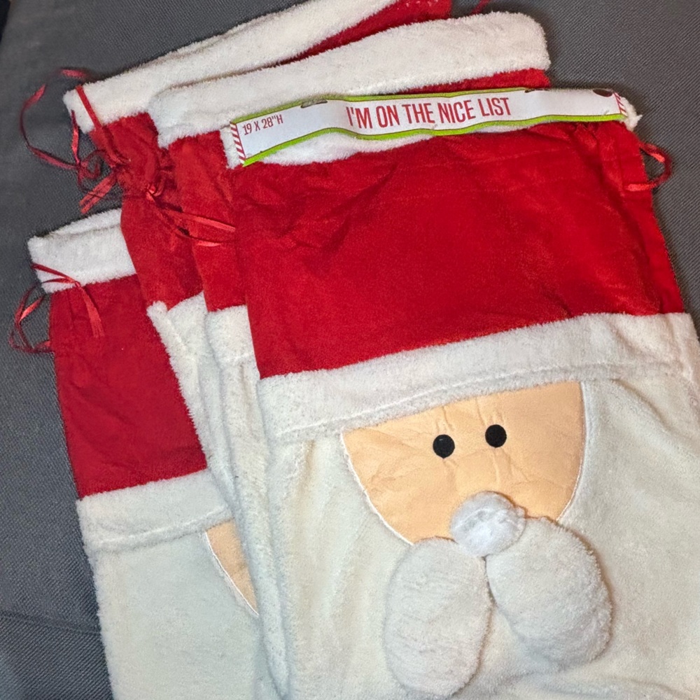 Set of 4 LARGE Santa cloth fleece gift bags w/drawstrings. NWT. 19” x 28”